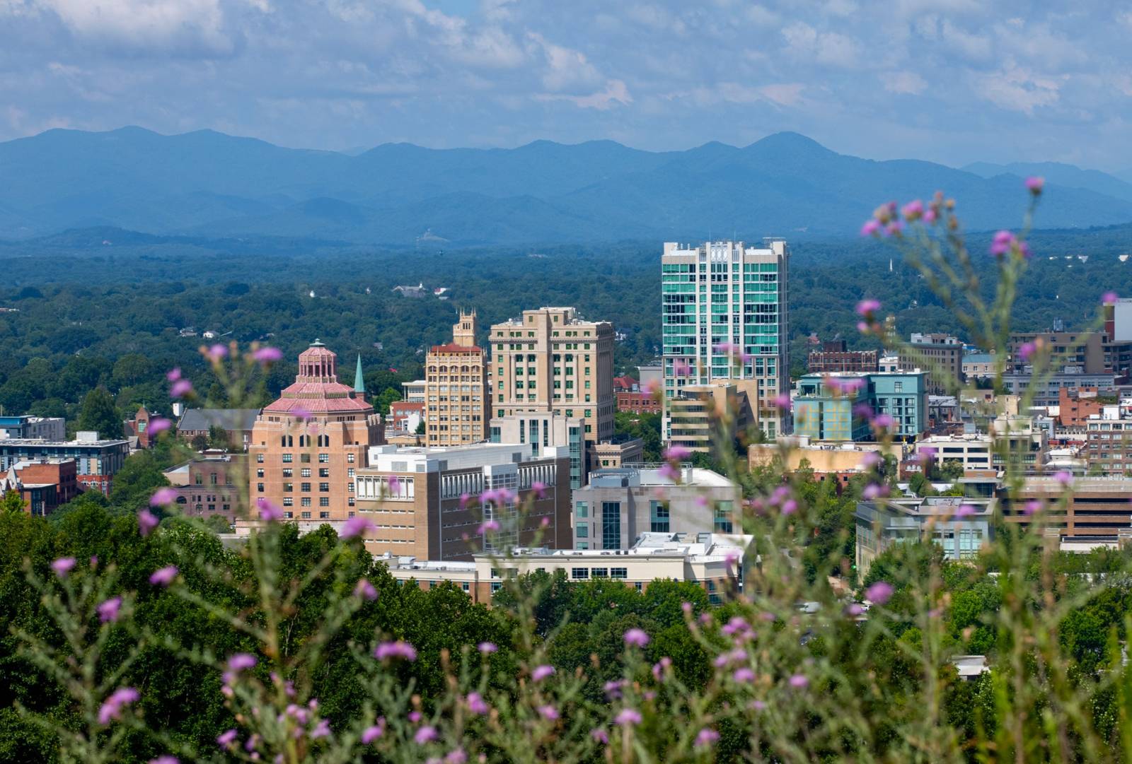 Downtown Asheville with the Blue Ridge Mountains behind